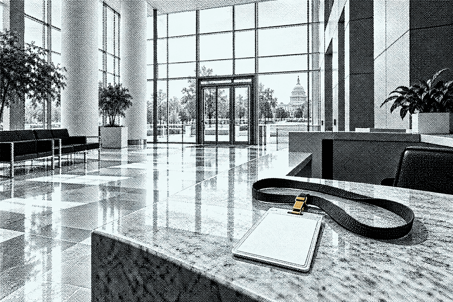 A sunlit glass office lobby with a blank visitor badge on a lanyard lying on the reception counter, its clip gold