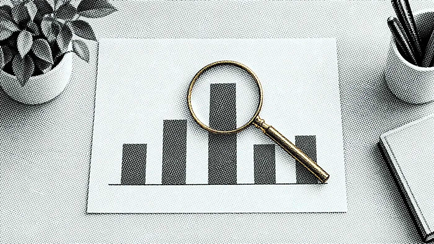 A magnifying glass resting over one bar of a simple unlabelled bar chart